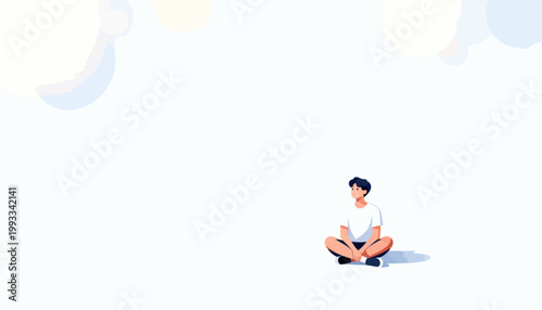 Young man sits calmly in soft light