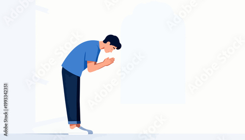 Man bows in prayer, hands pressed together