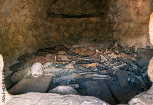 Fotografie Interior view of an ancient Dargavs burial crypt, revealing human skeletal remai