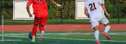 Soccer Players Compete on a Field During a Game