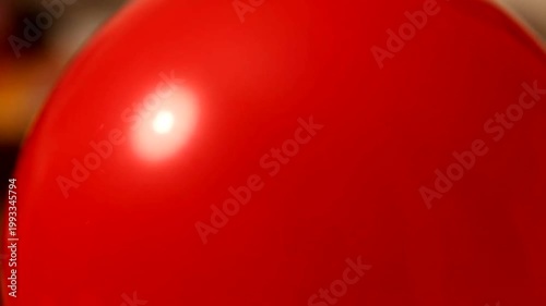 Closeup of a red balloon.