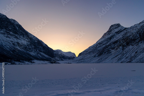 A beautiful winter sunrise scene near Geiranger. A colorful snowy landscape of Norway, UNESCO world heritage site.