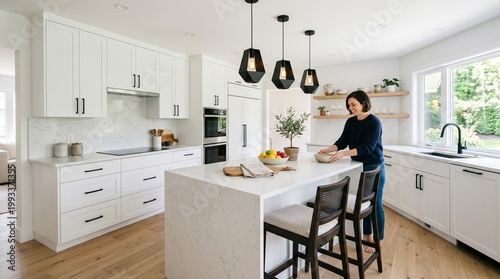 Modern White Kitchen Island with Woman Preparing Food, Stylish Pendant Lights