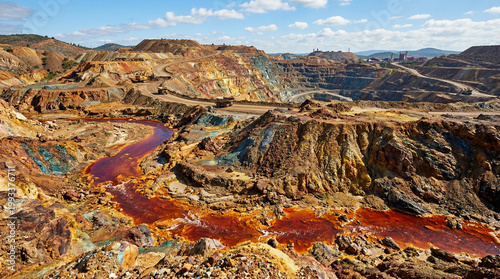 Old rusty metal and iron on red canyon rocks under a blue sky in a desert landscape