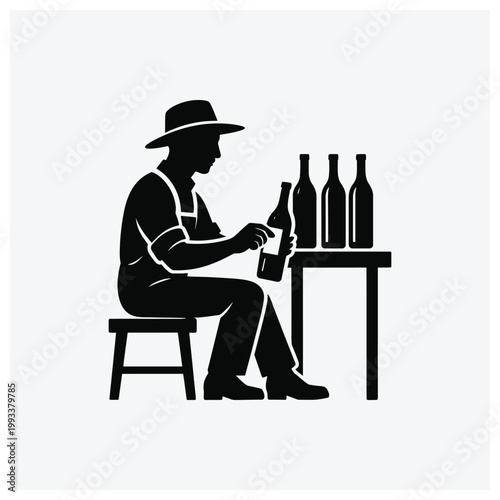Brewer pouring beer next to bottles of beer