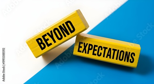 Two yellow blocks with motivational words beyond and expectations on a blue and white background