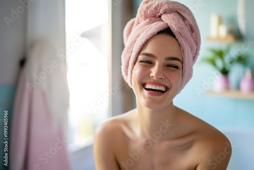 Woman With Towel in Bathroom Smiling at the Camera in Bright Natural Light Du...
