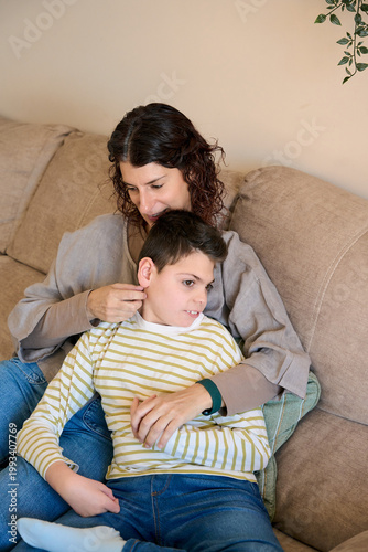 Mother caring for son with cerebral palsy