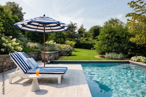 Sunny Day by the Pool With Lounge Chair and Striped Umbrella in a Garden