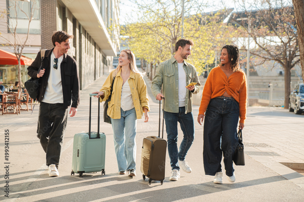 Naklejka premium A lively group of friends strolls happily together, each pulling their colorful suitcases and enjoying their time as they embark on a new adventure filled with excitement and joy.