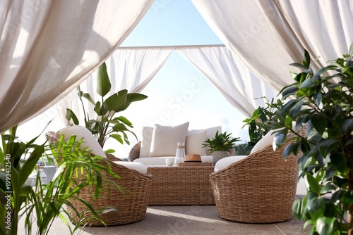 Cozy Seating Area With Plants and Soft Fabrics in an Outdoor Space During Day...