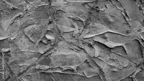 gray background, in the photo the texture of a gray wall with various lines, strokes and cracks