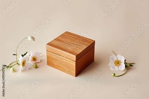 Wooden Box Surrounded by Colorful Flowers on a Plain Background During Daylight