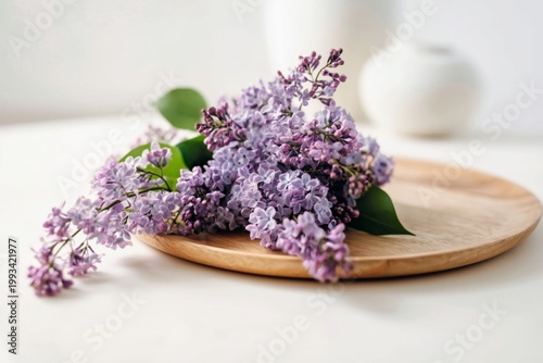Fresh Lilac Flowers Arranged on a Wooden Plate in a Bright Indoor Setting in ...