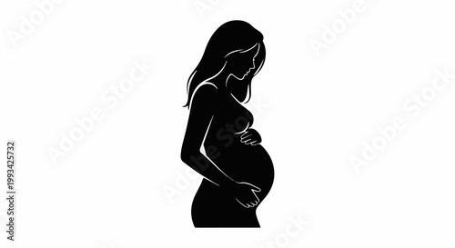 Silhouette of a pregnant woman cradling her belly