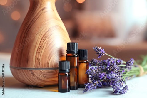 Lavender Oils and Diffuser Placed on Wooden Table With Lights in the Background