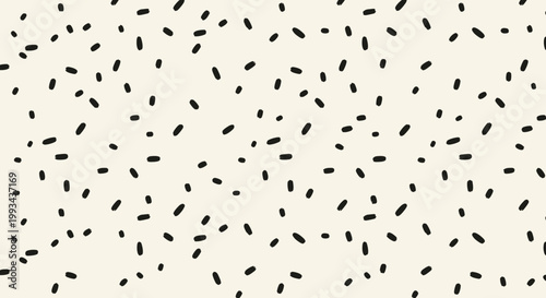 Abstract black dash pattern on a cream background, minimalist design
