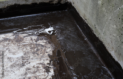 Photography Liquid membrane on concrete floor with vertical upturn detail