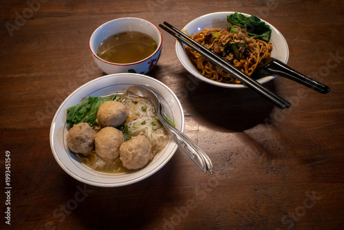 Indonesian street food, Mie Ayam and Bakso, noodles with meat balls and chicken meats