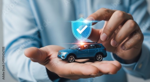 Car insurance concept with blue SUV model in hand, protective shield icon with checkmark, vehicle safety and digital security protection