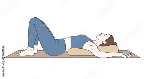 A woman lies on a yoga mat in a peaceful and serene pose