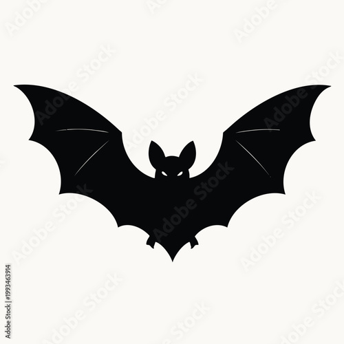 Black silhouette of a bat with wings spread wide