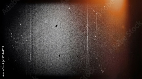 Vintage film texture with light leaks, grainy retro cinema background, distressed analog movie frame with scratches