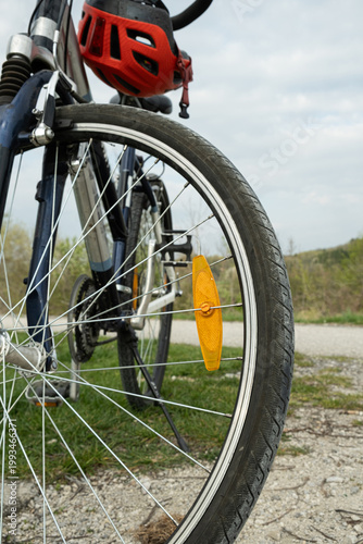 Wallpaper Mural Orange spoke reflector on a bicycle wheel close up. Torontodigital.ca