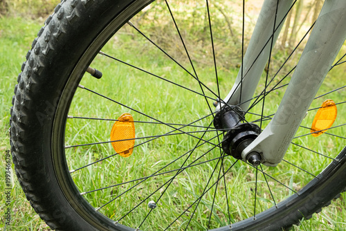 Wallpaper Mural Close-up of a bicycle wheel with yellow plastic reflectors. Torontodigital.ca