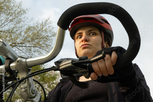 Wallpaper Mural Portrait of a funny female cyclist in a helmet close-up Torontodigital.ca