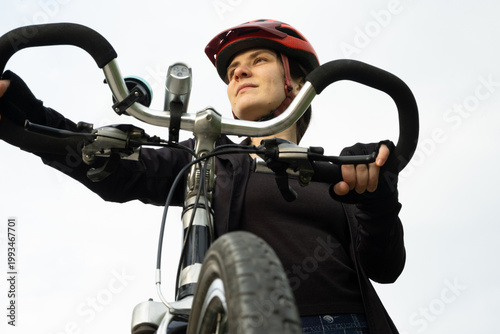 Wallpaper Mural Close-up of a young woman on a bicycle dreaming and enjoying the ride Torontodigital.ca