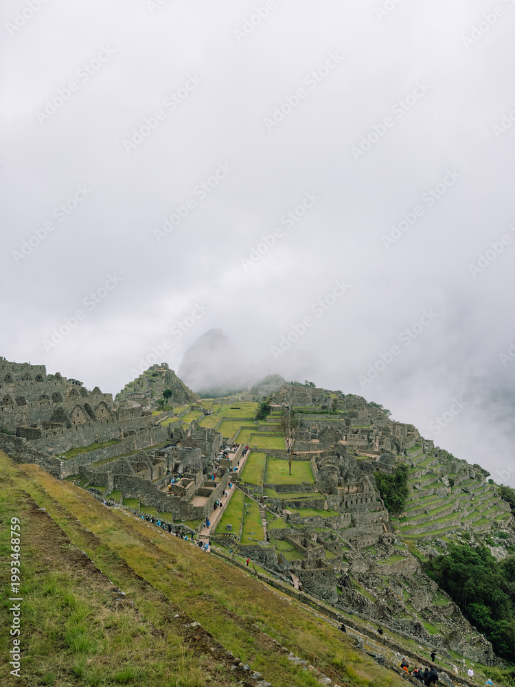 Fototapeta premium Vertical View of Machu Picchu Terraces and Ruins