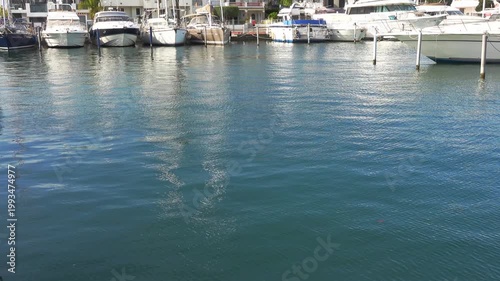 Boats are lined up at a marina by the water. Empuriabrava, Spain