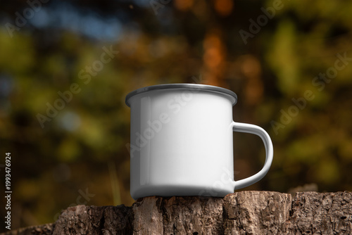 Template of enameled white mug with iron rim, metal dishware for hot drink, for design, branding on nature background.
