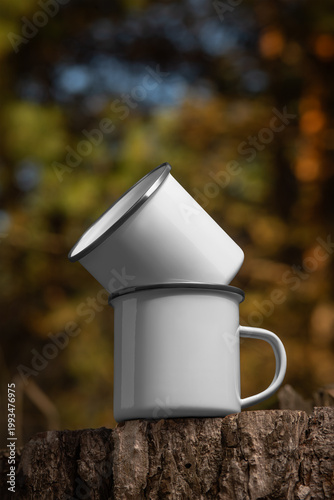 Mockup of enameled white mugs with iron rim, set of metal dishes, stacked, for design, pattern, branding.