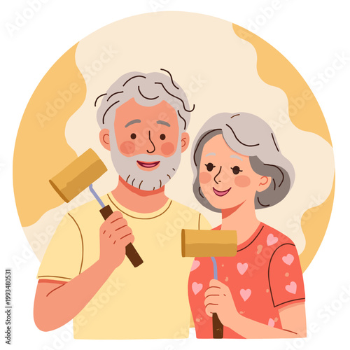 Happy elderly couple holding paint rollers in home renovation project. Elderly set   