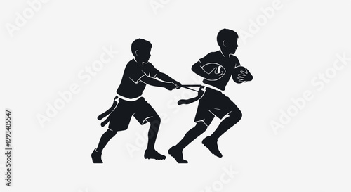Two children playing flag football, one running with the ball while the other tries to grab his flag