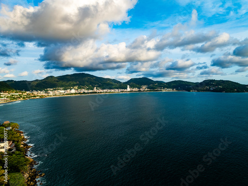 Aerial flying drone view seashore waves water surface texture in sunny tropical ocean at Phuket island Thailand