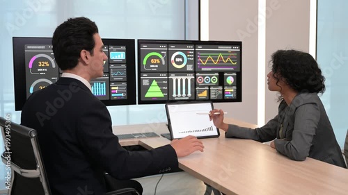 Diverse business team professional data analysts working together in office using tablet digital dashboard for financial marketing growth research. Expert colleagues analyzing corporate infographic ch