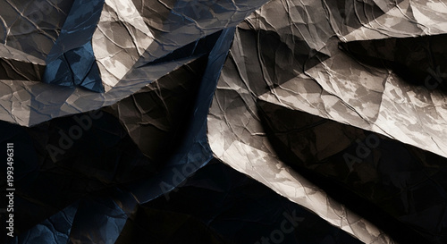 A close-up view of crumpled paper with dramatic lighting effects
