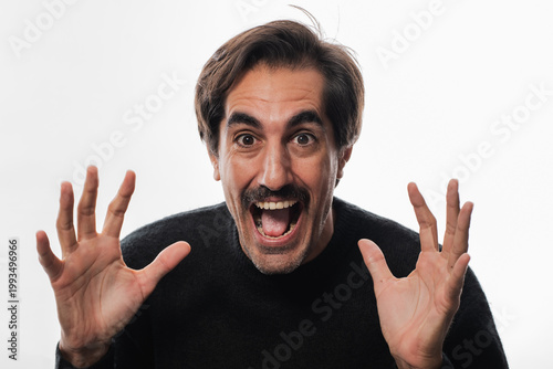 Fotografie Excitement fills the air as a man joyfully expresses his enthusiasm