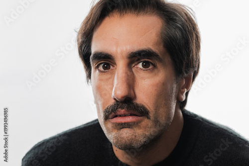 Captivating portrait of a man with expressive eyes and a thoughtful gaze