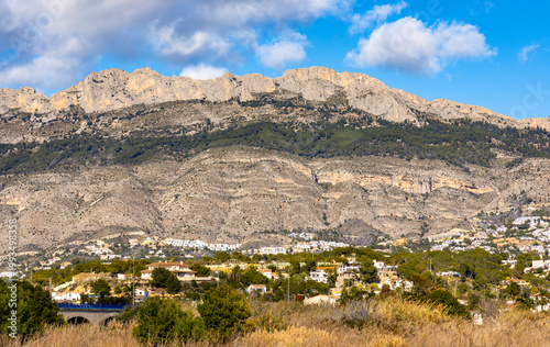Panoramic view of Sierra de Bernia range, part of Cordilleras Beticas Baetic Mountains at Mediterranean Sea Costa Blanca shore seen from Altea town in eastern Spain