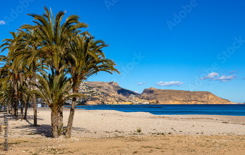 Panoramic view of Playa de Altea beach at the Mediterranean sea Costa Blanca shoreline with seafront Morro de Toix and Ilfach cliffs of Altea in Spain