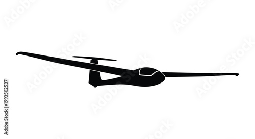 A sleek glider plane soars through the air in dark outline silhouette