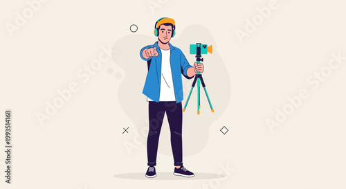 Young man vlogger with headphones and camera on tripod pointing at viewer