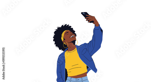 Stylish young black woman with an afro hairstyle taking a selfie with her smartphone while wearing a trendy blue jacket.