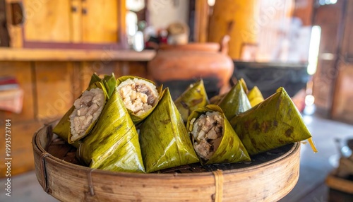 Steamed Sticky Rice Dumplings Filled with Pork and Mushrooms Wrapped in Green Banana Leaves