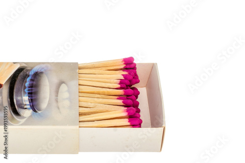 Wooden matches in paper boxes isolated on white background, close-up.
