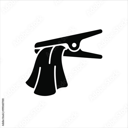 Black clothesline clip holding a towel laundry